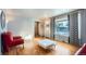 Living room with hardwood floors and red couches at 7625 W 23Rd Pl, Lakewood, CO 80214