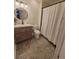 Bathroom featuring a stylish vanity, decorative mirror, and tiled flooring at 8500 E Jefferson Ave, Denver, CO 80237