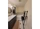 Stylish bathroom featuring a soaking tub, elegant fixtures, and mosaic tile flooring at 8500 E Jefferson Ave, Denver, CO 80237