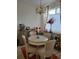 Elegant dining area features a chandelier, table setting, and stylish decor at 8500 E Jefferson Ave, Denver, CO 80237