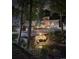 Beautiful night shot of the property's outdoor area with a waterfall feature at 8500 E Jefferson Ave, Denver, CO 80237