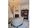 Chic living space with a fireplace, chandelier, and elegant decor at 8500 E Jefferson Ave, Denver, CO 80237