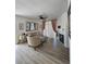 Inviting living room featuring a fireplace, large mirror, and stylish accents at 8500 E Jefferson Ave, Denver, CO 80237