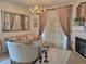 Bright living room boasts a fireplace, decorative mirror, and stylish furnishings at 8500 E Jefferson Ave, Denver, CO 80237
