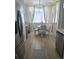Charming breakfast nook with floral curtains, wood flooring, and a round table with chairs at 8500 E Jefferson Ave # G, Denver, CO 80237