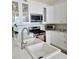 Bright kitchen with stainless steel appliances and white cabinetry at 8500 E Jefferson Ave # G, Denver, CO 80237