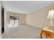 Bright and airy bedroom with plush carpeting and sliding glass doors to a balcony at 6410 S Dayton St # I1, Englewood, CO 80111