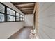 Enclosed patio with multiple windows, a covered ceiling, and an exterior door at 6410 S Dayton St # I1, Englewood, CO 80111