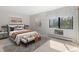 Bright bedroom with a king-size bed and access to a balcony at 14000 E Linvale Pl # 107, Aurora, CO 80014