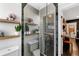 Modern bathroom with hexagon tile shower and floating shelves at 4270 Irving St, Denver, CO 80211