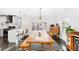 Bright dining room features dark wood floors, a modern light fixture, and a striped rug at 4270 Irving St, Denver, CO 80211