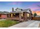 Brick home with a landscaped yard and driveway at 4270 Irving St, Denver, CO 80211