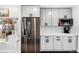 Modern kitchen with stainless steel appliances and ample cabinet space at 4270 Irving St, Denver, CO 80211