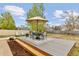 Relaxing backyard deck with a dining set, umbrella, and outdoor seating area, perfect for gatherings and relaxation at 4544 W 65Th Ave, Arvada, CO 80003