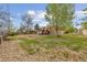 Spacious backyard with a patio area and mature trees, offering plenty of room for outdoor enjoyment at 4544 W 65Th Ave, Arvada, CO 80003
