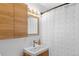 Bathroom featuring wood vanity and framed mirror at 4544 W 65Th Ave, Arvada, CO 80003