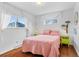 Cozy bedroom with hardwood floors, natural light, and colorful decor at 4544 W 65Th Ave, Arvada, CO 80003