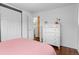 Bedroom featuring hardwood floors, a closet and dresser for ample storage at 4544 W 65Th Ave, Arvada, CO 80003