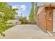 Spacious driveway with brick house, providing ample parking and easy access to the property with green trees around at 4544 W 65Th Ave, Arvada, CO 80003