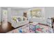 Bright living room with hardwood floors, a large window, and a comfortable white couch at 4544 W 65Th Ave, Arvada, CO 80003