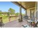 Covered back deck with outdoor seating and beautiful view of the landscaped yard at 16550 Antero Cir, Broomfield, CO 80023