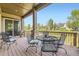 Cozy covered deck with dining table perfect for outdoor entertaining with backyard views at 16550 Antero Cir, Broomfield, CO 80023