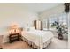 Cozy bedroom with natural light, hardwood floors, and a serene ambiance at 16550 Antero Cir, Broomfield, CO 80023