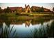 Stunning clubhouse reflected in a serene pond amidst manicured lawns and landscaping creates a picturesque view at 16550 Antero Cir, Broomfield, CO 80023
