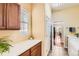 Well-lit laundry room with ample counter space and modern appliances at 16550 Antero Cir, Broomfield, CO 80023