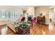 Cozy living room showcasing hardwood floors, a fireplace, and comfortable seating at 16550 Antero Cir, Broomfield, CO 80023