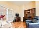 Inviting home office with hardwood floors, built-in desk, and comfortable seating area at 16550 Antero Cir, Broomfield, CO 80023