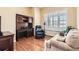 Comfortable office space featuring built-in shelving, a large window, and ample seating at 16550 Antero Cir, Broomfield, CO 80023
