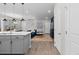 Open-concept living space with modern gray cabinets, and seamless flow into the living area at 11420 E 26Th Ave, Aurora, CO 80010