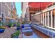 Charming backyard with a patio area, steps leading to a garden, and well-maintained landscaping at 13713 Raritan Ln, Broomfield, CO 80023