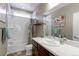 Bright bathroom featuring a tub and shower combination, with modern fixtures and warm neutral tones at 13713 Raritan Ln, Broomfield, CO 80023