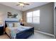 This bedroom features a comfortable bed, neutral walls, and a large window for natural light at 13713 Raritan Ln, Broomfield, CO 80023