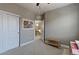 Comfortable bedroom showcasing neutral walls, closet with sliding doors, and doorway to the upstairs hallway at 13713 Raritan Ln, Broomfield, CO 80023