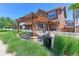 Community pergola with seating area and well-manicured landscaping at 13713 Raritan Ln, Broomfield, CO 80023
