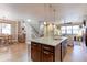 Open-concept kitchen features a large island, stainless appliances, and easy access to the living room at 13713 Raritan Ln, Broomfield, CO 80023
