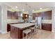 Modern kitchen featuring stainless steel appliances, granite countertops, and a center island with seating at 13713 Raritan Ln, Broomfield, CO 80023