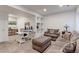 Inviting living room offering a comfortable seating area and a dedicated workspace with built-in shelving at 13713 Raritan Ln, Broomfield, CO 80023