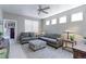 Cozy living room with comfortable seating, neutral walls, and a ceiling fan at 13713 Raritan Ln, Broomfield, CO 80023