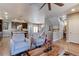 Bright living room showcases an open floor plan, seamlessly connecting to the kitchen and dining area at 13713 Raritan Ln, Broomfield, CO 80023