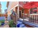 Inviting patio with a comfortable seating area, umbrella, and access to a beautifully landscaped backyard at 13713 Raritan Ln, Broomfield, CO 80023