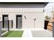 Well-maintained backyard with artificial grass and contemporary design elements at 3927 N Cook St, Denver, CO 80205
