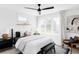Bright bedroom with a large window, black accents, and a ceiling fan at 3927 N Cook St, Denver, CO 80205
