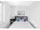 Cozy bedroom featuring a soft bed, stylish pillows, and minimalist decor at 3927 N Cook St, Denver, CO 80205