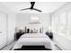 Comfortable bedroom with a ceiling fan, large windows, and stylish bedside tables at 3927 N Cook St, Denver, CO 80205