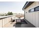 Stylish roof deck featuring modern outdoor seating and dining area at 3927 N Cook St, Denver, CO 80205