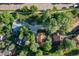 Aerial shot of homes with mature trees, manicured lawns and spacious driveways at 6396 Twin Lakes Rd, Boulder, CO 80301